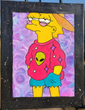 Colorful artwork of a character with an alien design on a pink sweater, framed on an easel.