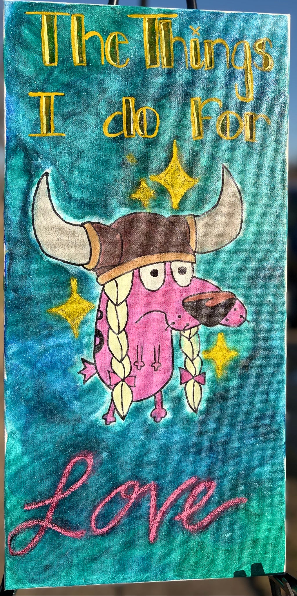 Cartoon character with horns and braids on a blue background with text 'The Things I do for Love'.